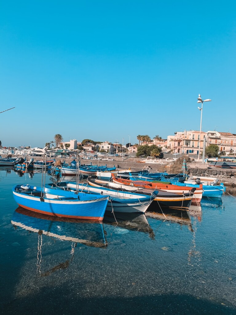 blue and brown boat on dock during daytime